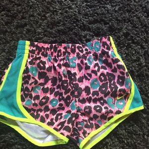Pink blue and neon green Nike shorts